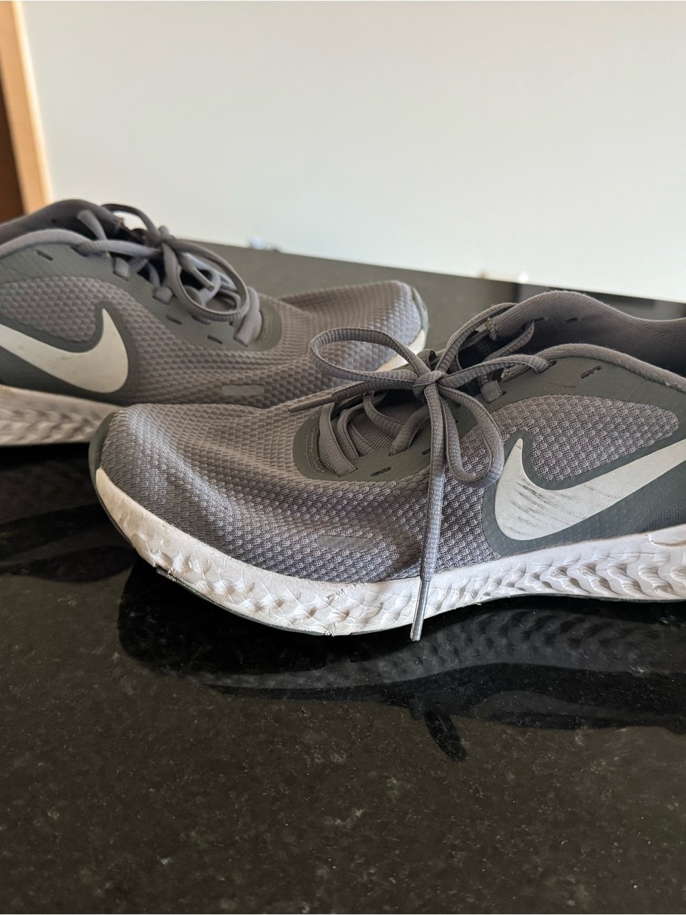 Nike Men’s Gray Athletic Running Shoes with White Swoosh